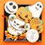 Halloween gingerbread cookies with candies on orange background iStock 1178017989