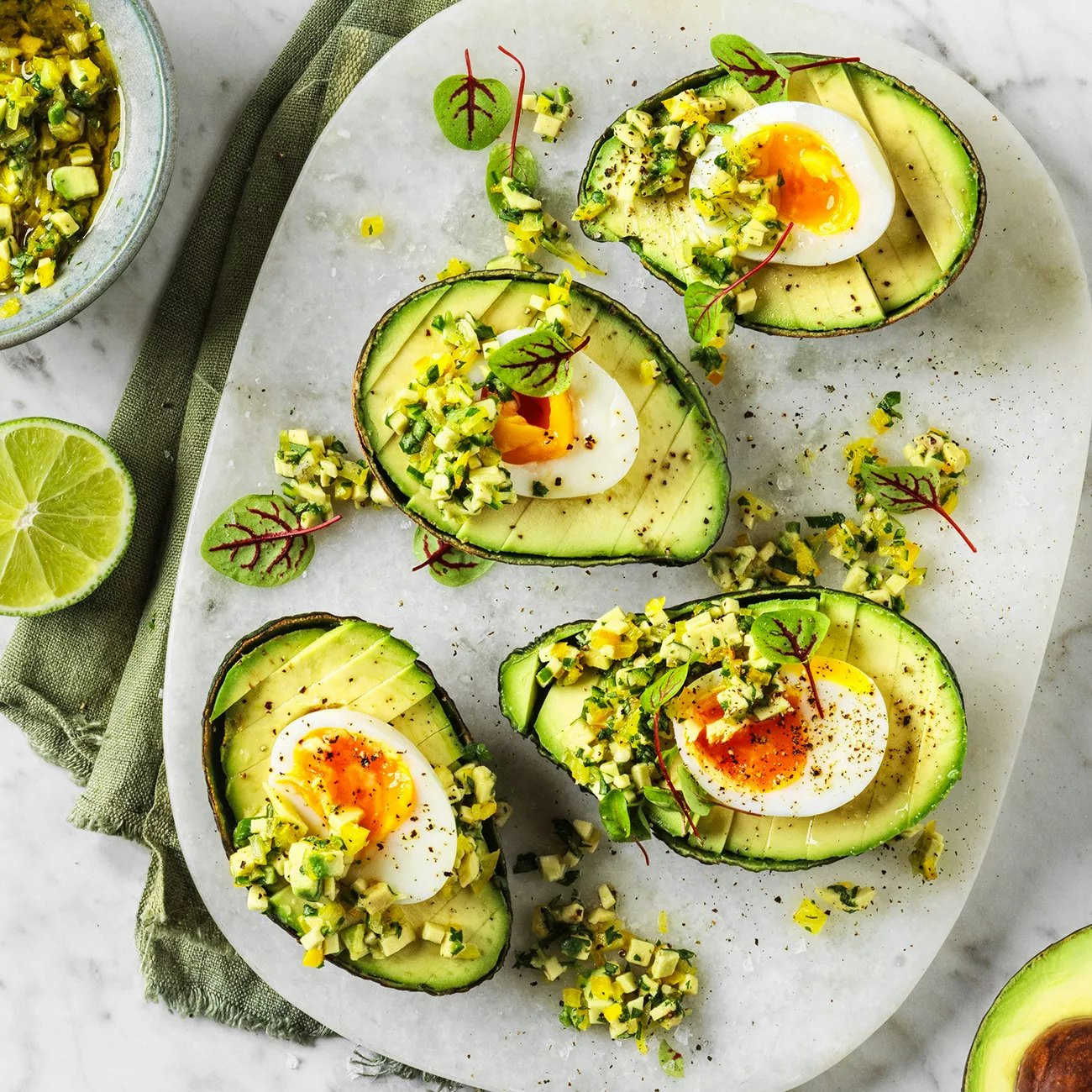 avocado with soft boiled eggs and avocado jalapeno salsa